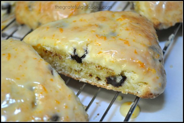 Chocolate Chip Orange Scones with citrus glaze, cooling on wire rack