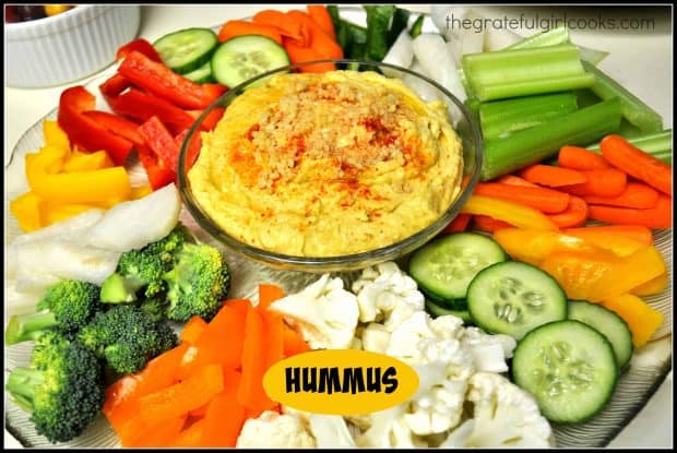 Creamy hummus, with minced garlic, is an easy to make from scratch dip to serve as an appetizer with pita chips, pita bread or fresh vegetables.