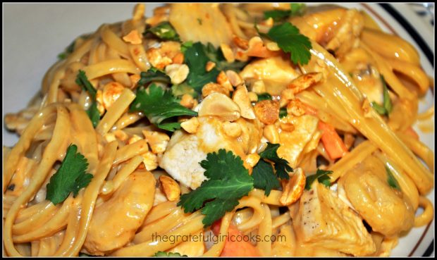 A portion of the Thai chicken linguini, garnished with cilantro and chopped peanuts.
