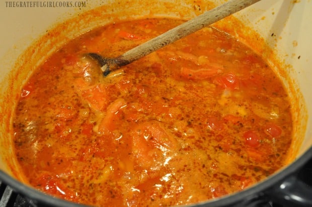 Cooking the tomato soup before pureeing the tomatoes.