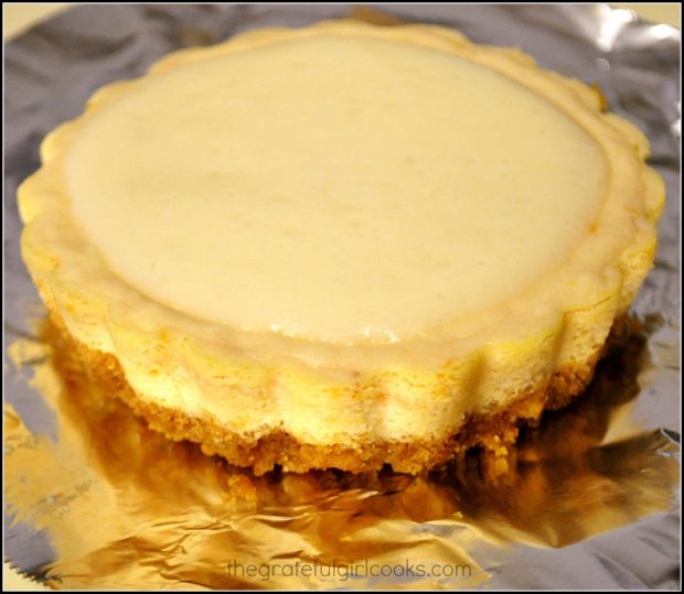 A ricotta topping is added to the cooled, baked mini-cheesecakes.