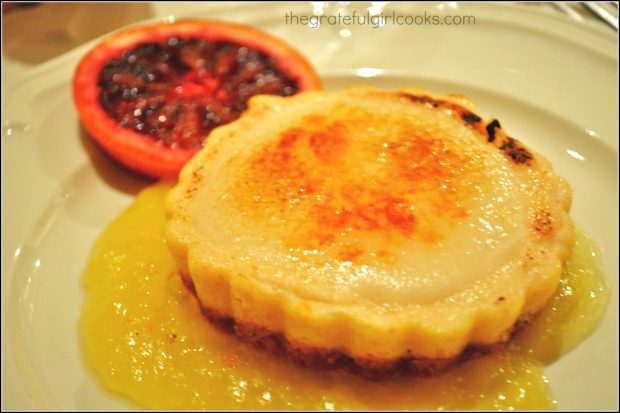 The orange mini-cheesecakes are served on top of the citrus sauce.