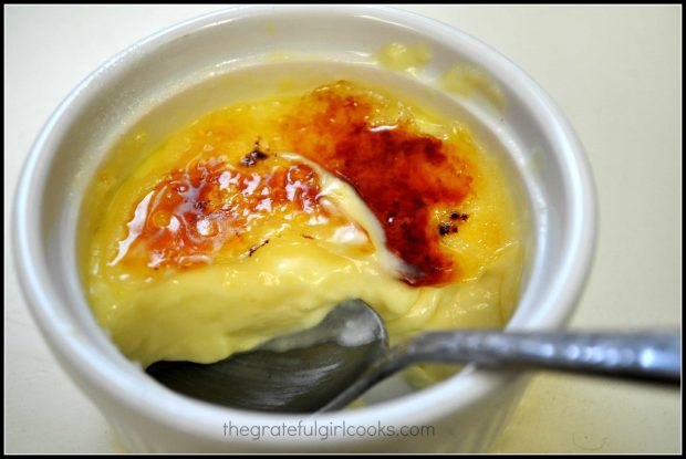 The crust is cracked open on the creme bruleé, revealing the custard filling.