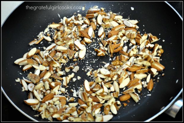 Sliced almonds are lightly toasted in a dry skillet.