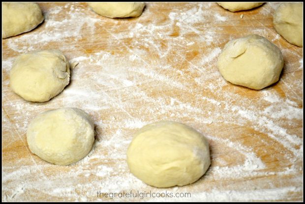 The tortilla dough is shaped into 8 equal sized dough balls.