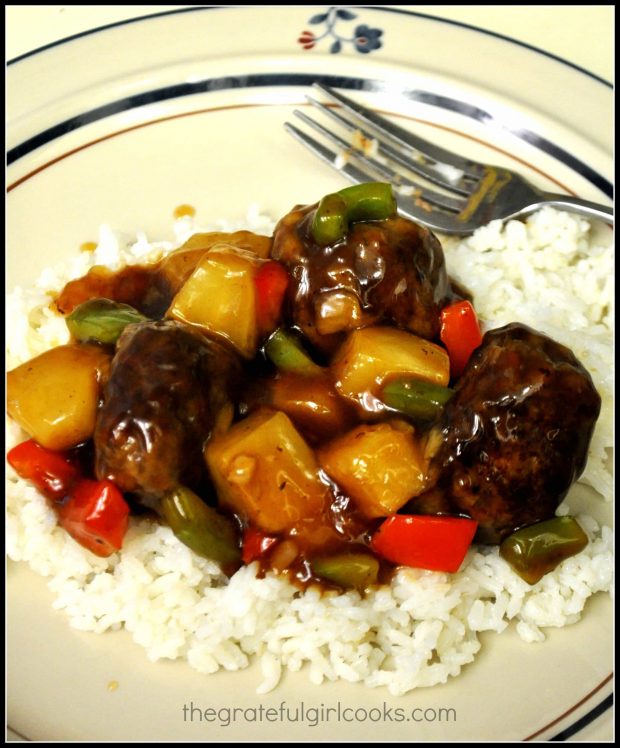 Hawaiian meatballs served on a bed of white rice.