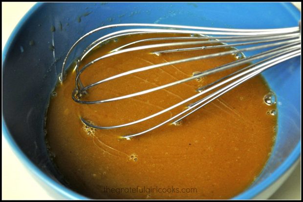 Whisking the sweet and sour stir fry sauce for Hawaiian meatballs.