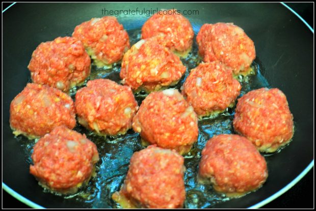 Meatballs are cooked on all sides until browned.