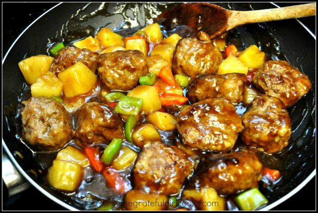 Hawaiian meatballs are added to sauce, peppers and pineapple.