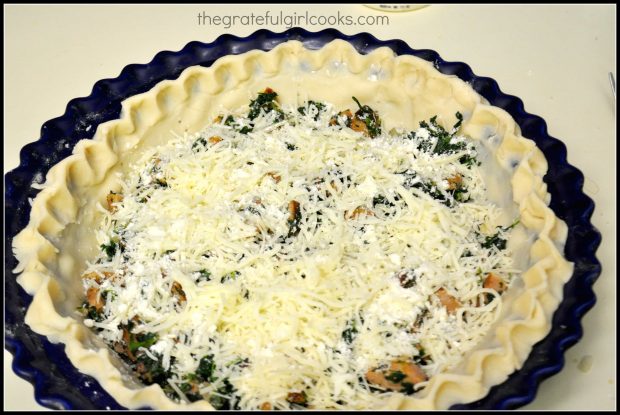 Cheeses and meat mixture is added to the unbaked pie crust.