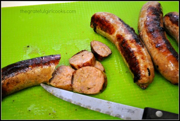 The cooked Italian sausage links are cut in thin slices.