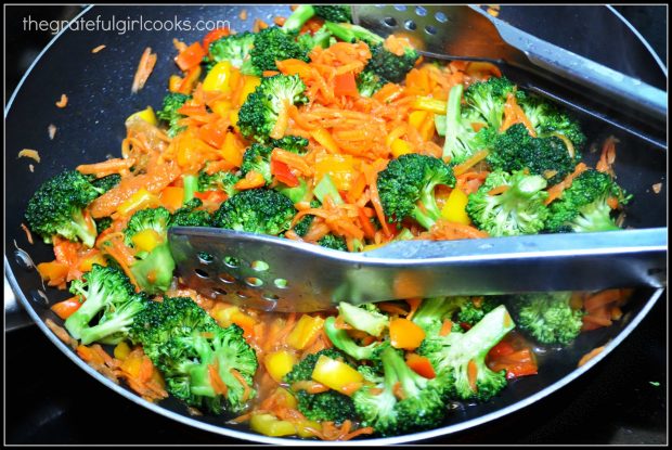 Broccoli, bell peppers and carrots are stir-fried in orange sauce.