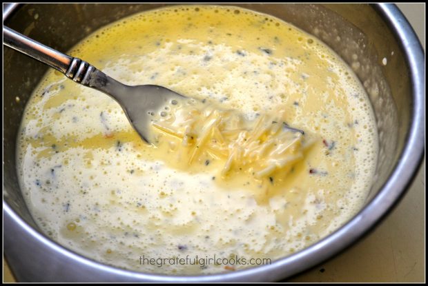 The egg mixture is mixed together and eggs are tempered before adding to hot skillet.