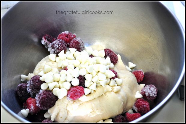 White chocolate chips and raspberries are added to scone dough.