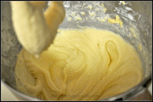 Mixing apple cinnamon bread batter in metal bowl