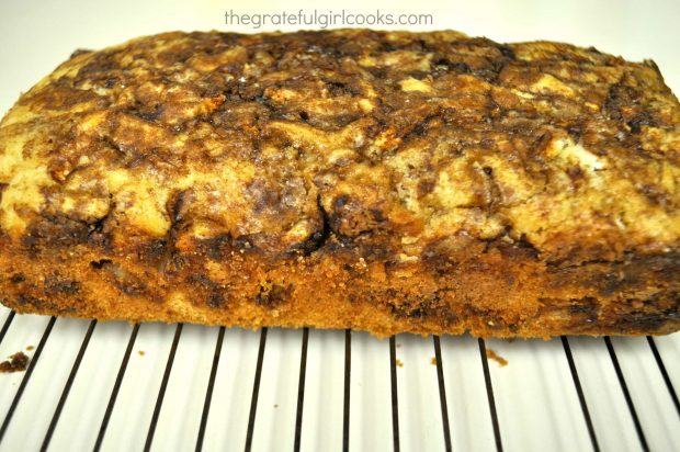 Side view of apple cinnamon bread on wire rack