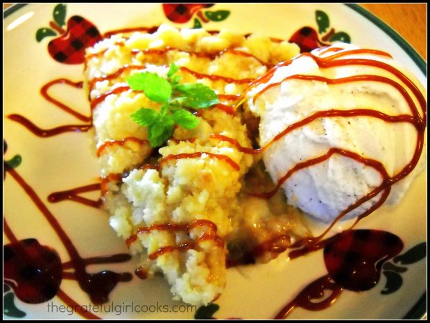 This slice of apple shortbread tart is served with browned caramel sauce and ice cream