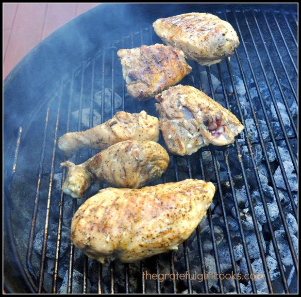 Grilling chicken with easy basting sauce on Weber BBQ .