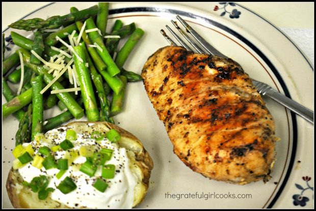 Grilled chicken basting sauce covered chicken breast, served with baked potato and asparagus!