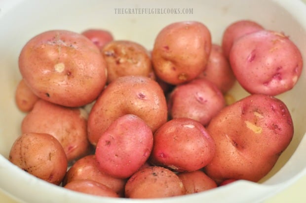 We enjoy using red potatoes for this recipe for oven roasted herb potatoes.