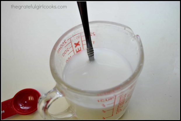 Mixing up cornstarch in measuring cup to make thickened sauce for P.F. Chang's ginger chicken.