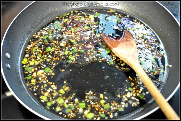 Asian stir fry sauce for P.F. Chang's ginger chicken cooking in skillet.