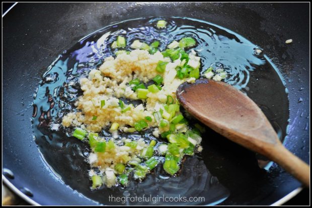 Garlic, green onions and ginger, cooking in skillet for P.F. Chang's ginger chicken.