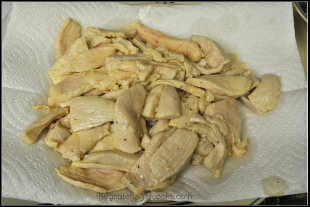 Cooked chicken, draining on paper towel.