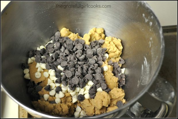 Semi sweet chocolate chips and white chocolate chips are added to cookie dough.