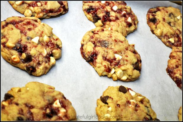 Some of the baked cookies, cooling on the baking sheet.