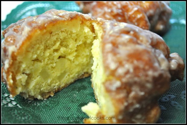 A fritter cut open to show the inside apples