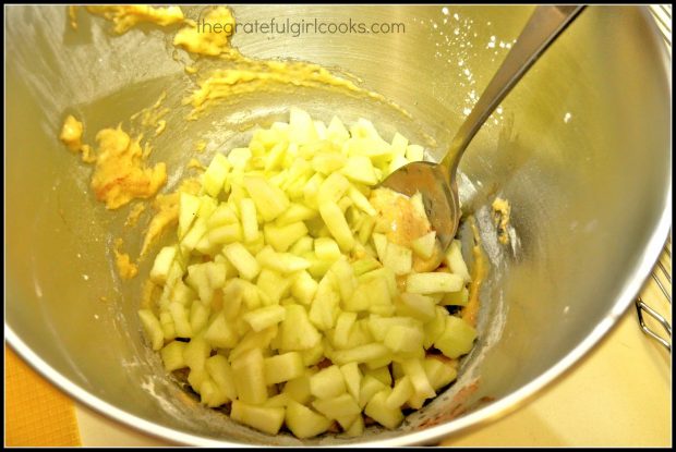 Apples being added to mixing bowl