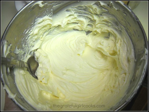Cheesecake filling for the brownie bites is mixed together in a large bowl until smooth.