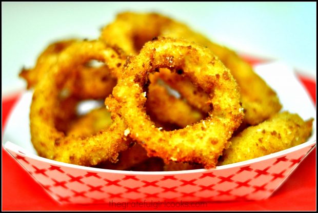 Homemade onion rings in a red and white tray