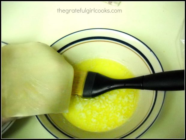 Brush melted butter onto a won ton wrapper for lemon curd won ton cups.