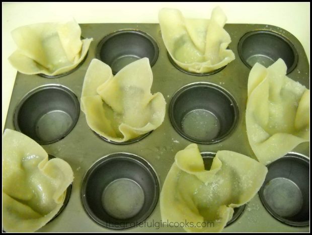 Shaping won tons into cups, in muffin tin