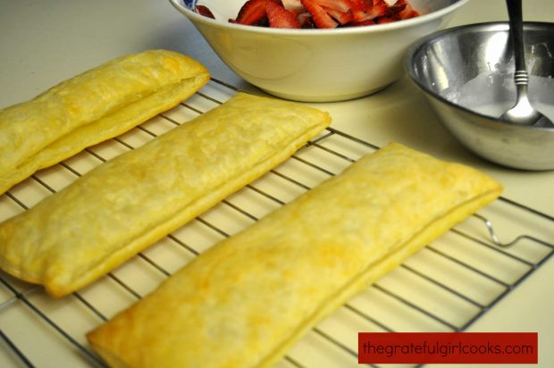 Baked puff pastry, ready to slice and fill for chocolate strawberry napoleons dessert.