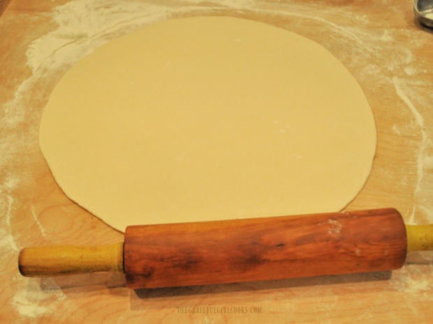 Dough balls are rolled out into 7" circles.