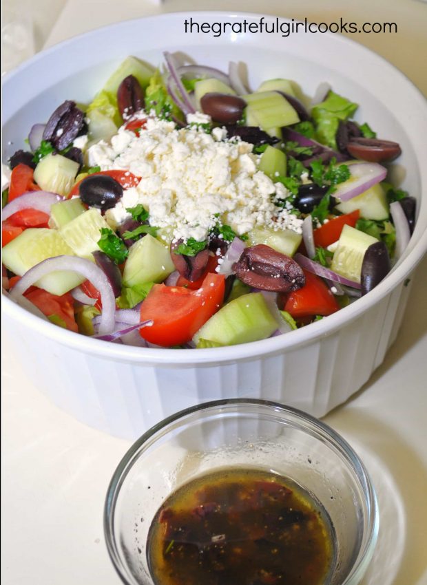 Feta cheese and kalamata olives are added to the Greek salad. Homemade salad dressing on side.