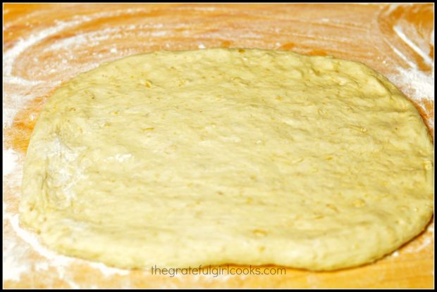 Honey oat bread dough is rolled into rectangle shape.