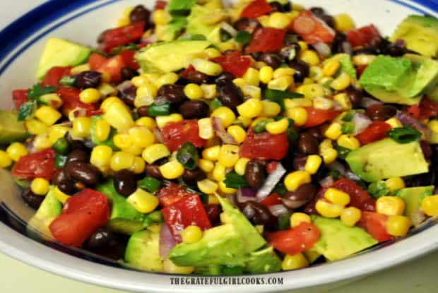 The Southwestern black bean salad is served, covered in a lime and olive oil dressing.