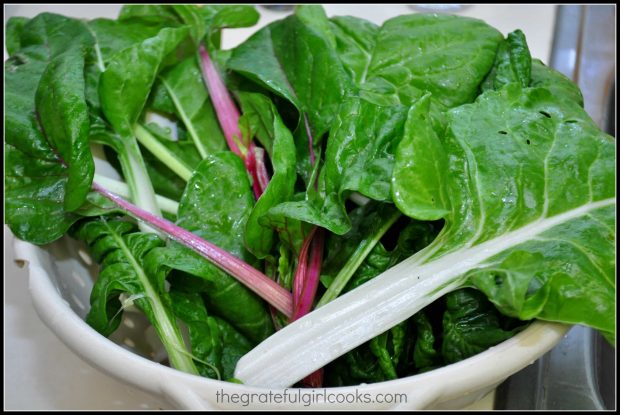 The Swiss chard leaves are rinsed and drained well, before cooking.