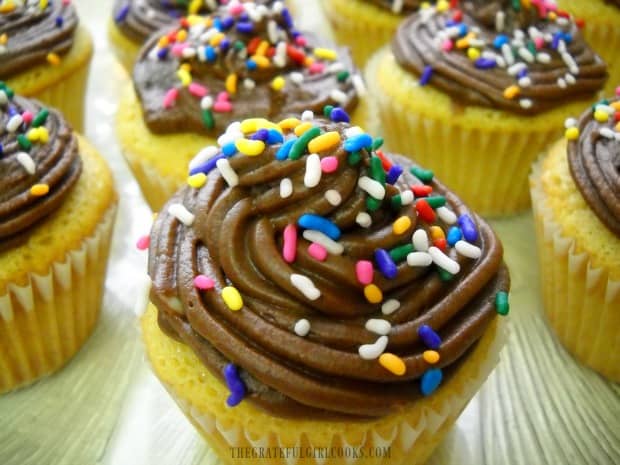 Mom's chocolate buttercream frosting on yellow cupcakes.