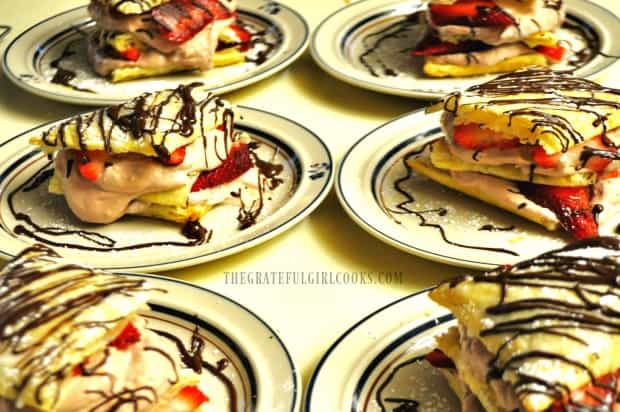 Chocolate strawberry napoleons on plates, ready to serve to guests!