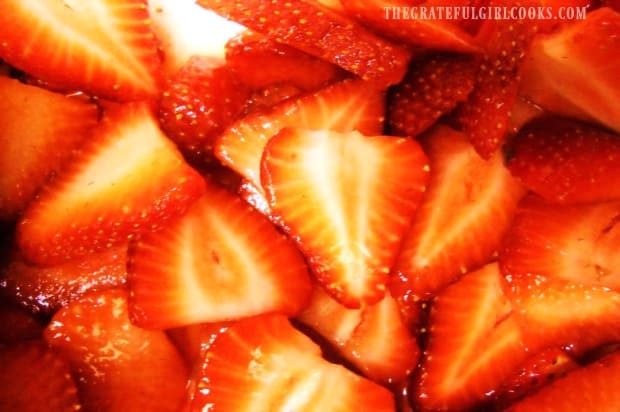 Fresh strawberries are mascerated in sugar and water for chocolate strawberry napoleons.