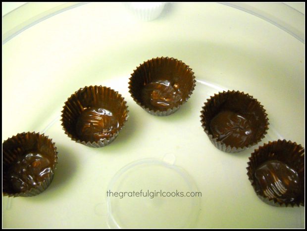 Chocolate dream cups resting on platter while chocolate hardens