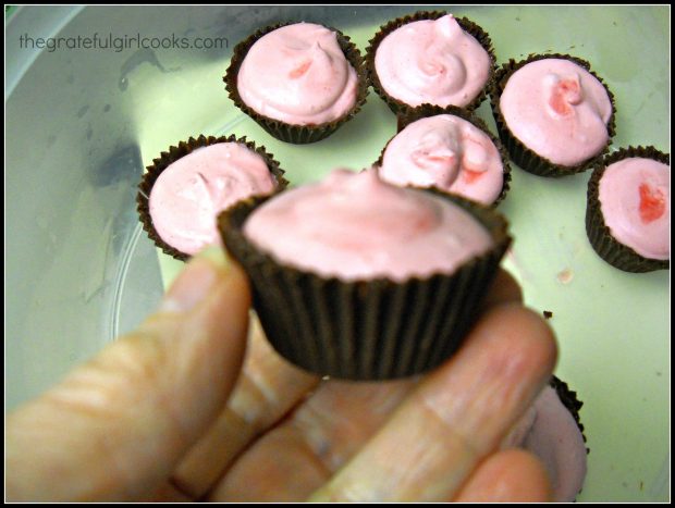 Miniature edible chocolate dream cups are filled with raspberry mousse.