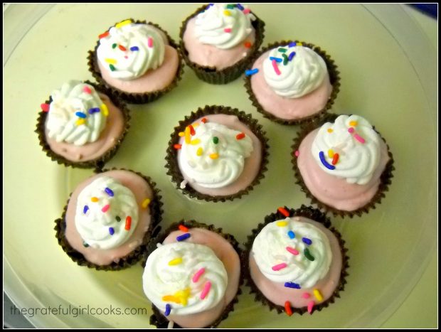 Chocolate dream cups are topped with whipped cream and sprinkles to serve.