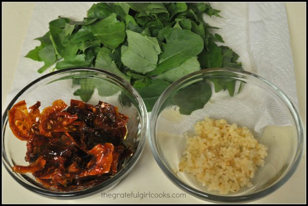 Arugula, sun-dried tomatoes and garlic, ready to add to the pasta dish.