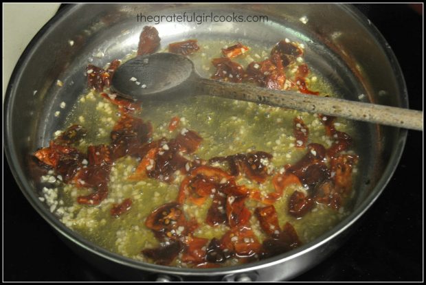 White wine and starchy pasta water are added to the sun-dried tomatoes.